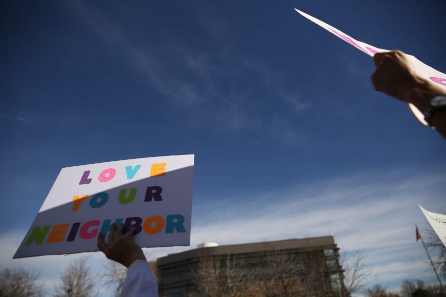 Supporters of  DACA hold signs in support of the rights of undocumented persons at Colorado State University during a rally in the Plaza. (Forrest Czarnecki | Collegian)