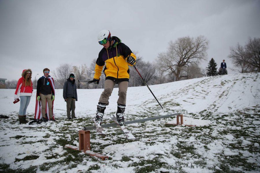 Colorado State University freshman Chaz Hogenauer takes full advantage of the first snow of the year in Fort Collins by using his snowboard on the Lagoon field hill on Thursday afternoon. Several inches of snow fell on Thursday afternoon, and temperatures are predicted to stay in the low 40s for Friday. (Forrest Czarnecki | Collegian)