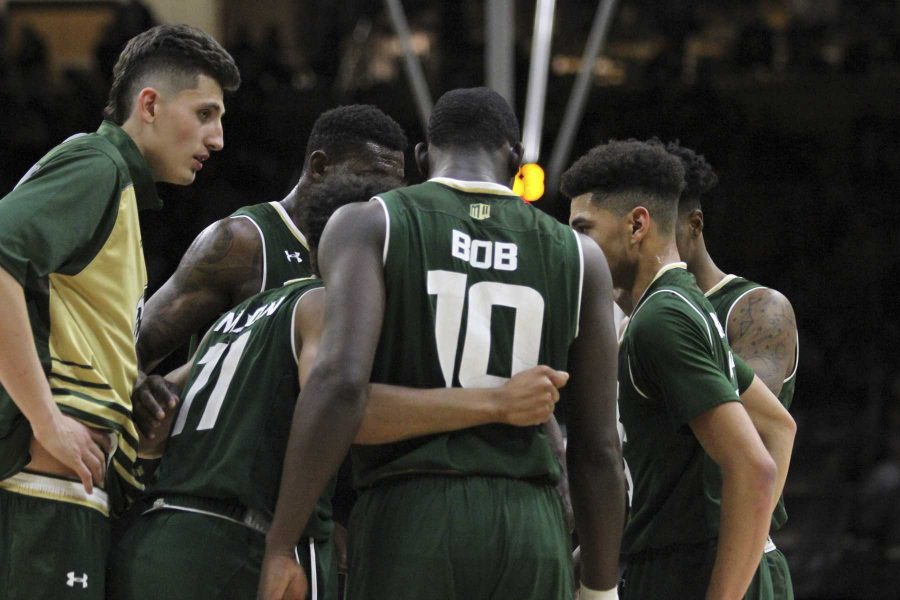 CSU Mens Basketball team during a timeout come together and discuss the game plan during the 2nd half of the Rams 72-58 win over rival CU. (Javon Harris | Collegian)