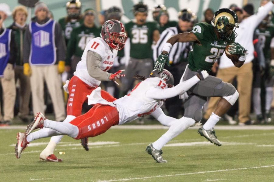 Colorado State University running back Marvin Kinsey Jr. breaks a tackle against New Mexico at the final game at Hughes Stadium on Nov 19. (Luke Walker | Collegian)