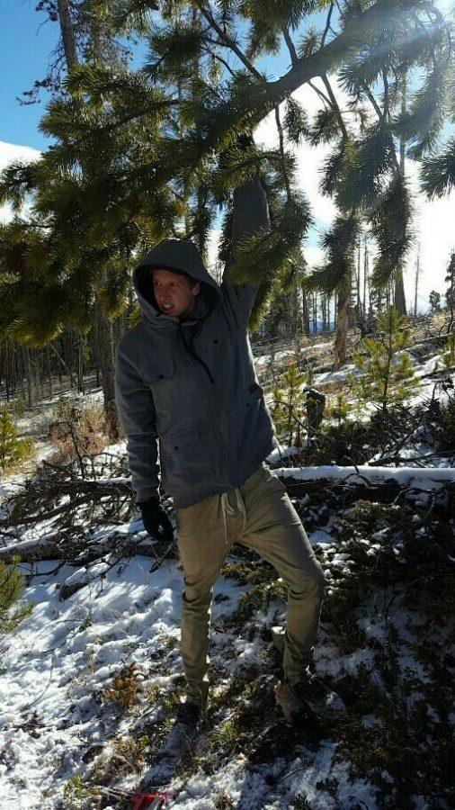 Russell Winterling carries the winning tree to the Jeep. Photo credit: Adelayde Dahlin