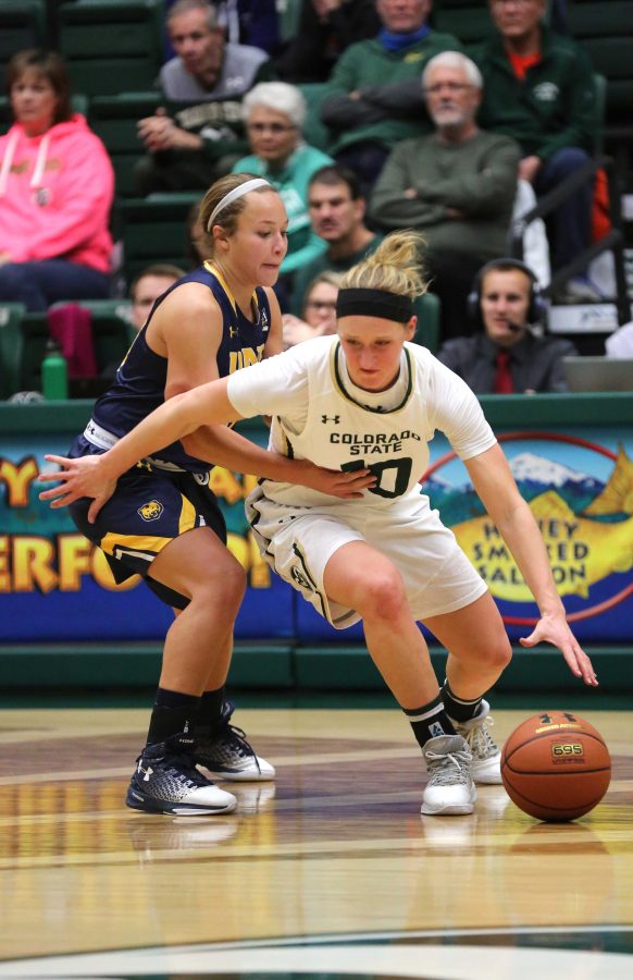 Colorado State University's Hannah Tvrdy (10) takes the ball around a University of Northern Colorado player during the second half of the game on Sunday afternoon against the University of Northern Colorado. The Rams beat the visiting Bears 58-47. (Forrest Czarnecki | Collegian)
