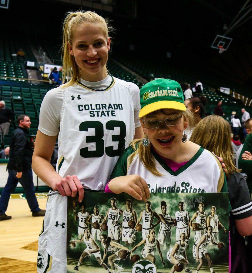 CSU Freshman Anna Dreimane signs posters with fans after the game on January 18, 2017 (Davis Bonner | Collegian)