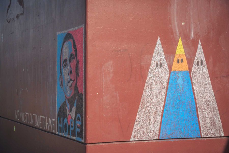 Two chalk murals decorated the side of Clark A on the morning of Trump's Inauguration. (Davis Bonner | Collegian)