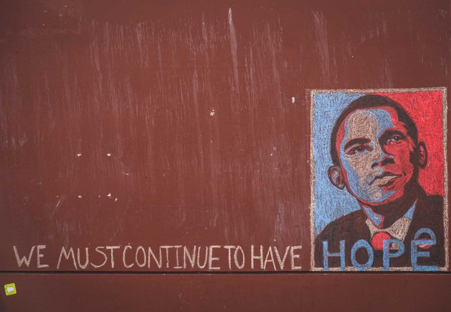 A chalk mural decorates the side of Clark A on the morning of Trump's Inauguration. (Davis Bonner | Collegian)