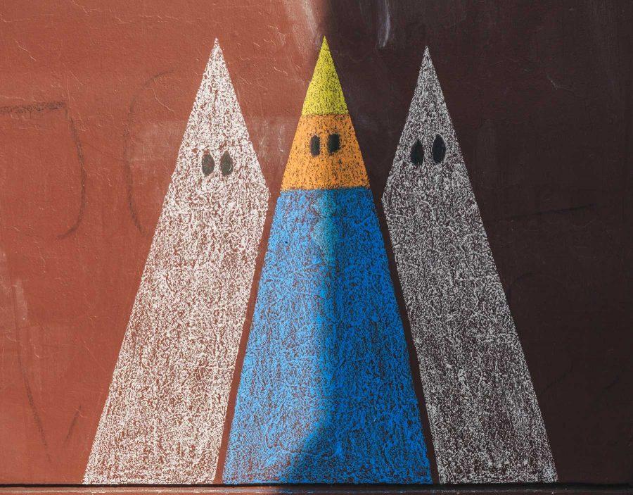 A chalk mural decorated the side of Clark A on the morning of Trump's Inauguration before being washed away. (Davis Bonner | Collegian)