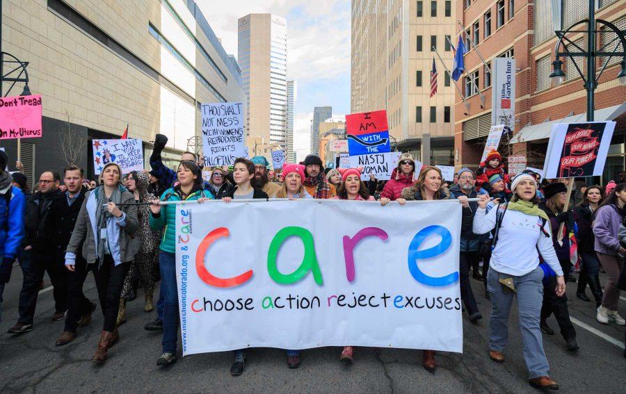 Parade leaders pass the convention center during the Women's March in Denver, January 21, 2017 (Davis Bonner | Collegian)