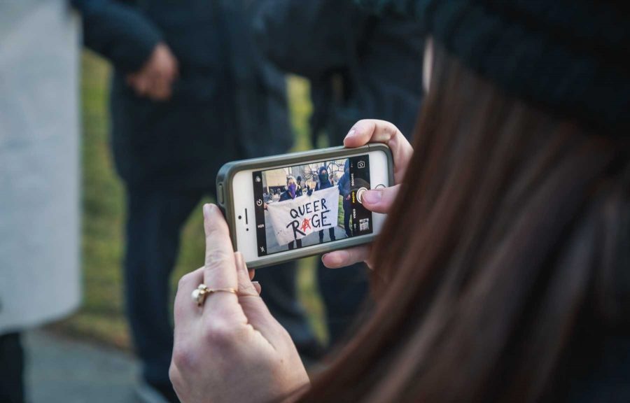 Collegian reporter Erin Douglas documents those protesting CU's hosting of Milo Yiannopoulos (Davis Bonner | Collegian)