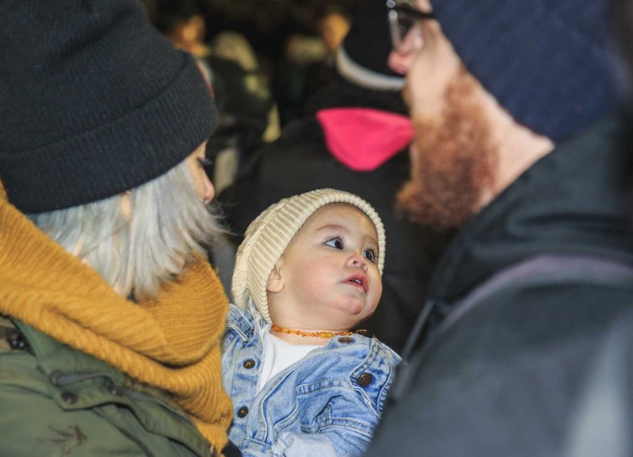 A small child makes an appearance in the crowd protesting  Milo Yiannopoulos' appearance at CU (Davis Bonner | Collegian)