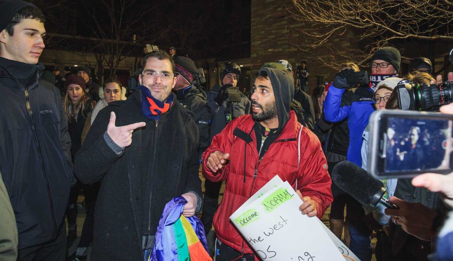 Two protesters attempt to discuss their disagreements outside Milo Yiannopoulos' event at CU (Davis Bonner | Collegian)