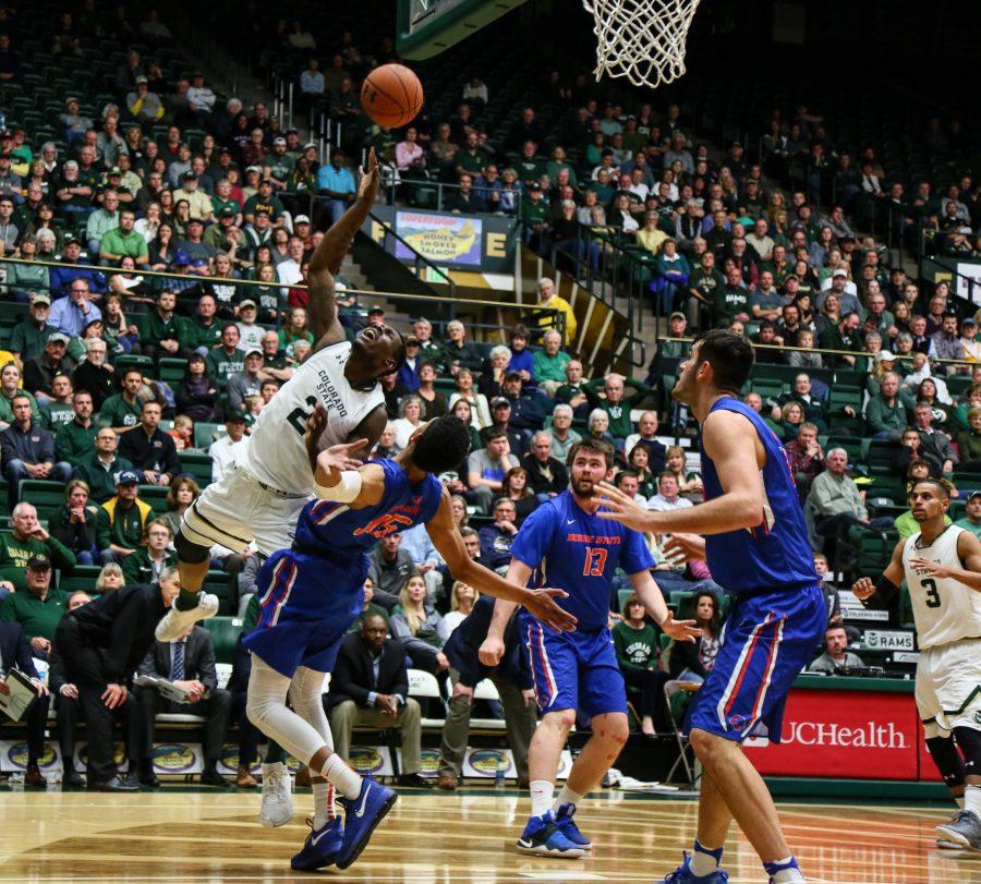 Boise State's Chandler Hutchinson get in the way of Emmanuel Omogbo's layup during their 79-76 loss, January 31, 2017 (Davis Bonner | Collegian)