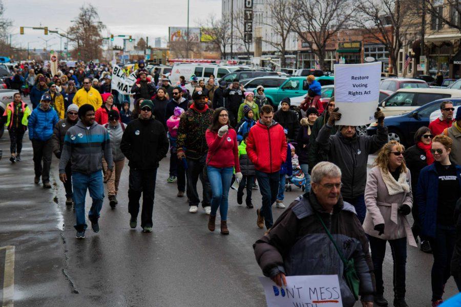 The Fort Collins Community participates in the MLK March by walking down College St with political statements in their hands (Julia Trowbridge | Collegian)