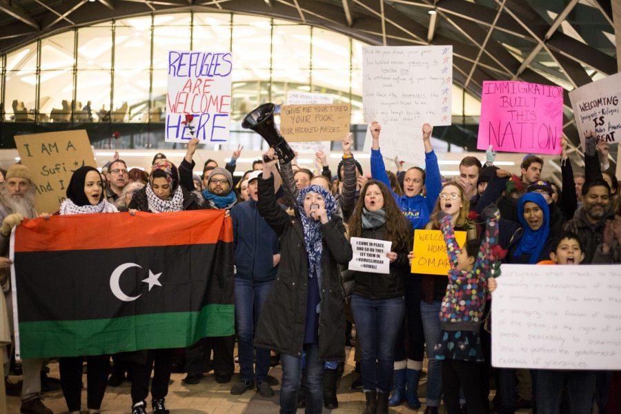 Protesters against Donald Trump's executive order banning travel to the U.S. by citizens of seven Muslim-majority countries cheer at Denver International Airport on Saturday, Jan. 28, 2017. The protest was one of several that took place nationwide. Photo courtesy of Daniel Sauve.