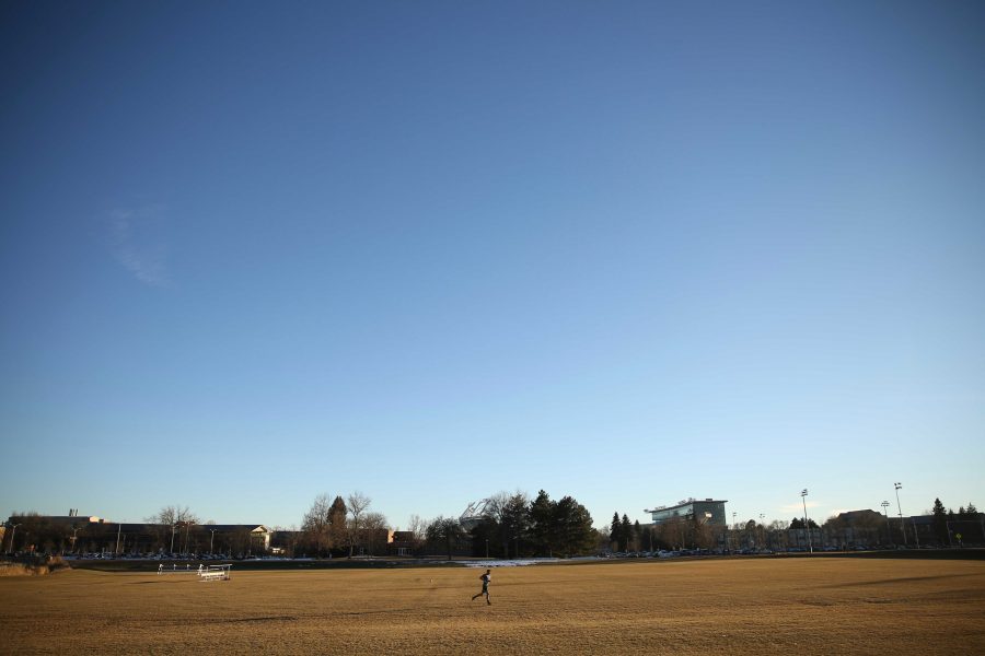 Colorado State University junior Ryan Schlachter practices his soccer skills at the Lagoon Field as the sun sets on January 18th. (Forrest Czarnecki | Collegian)