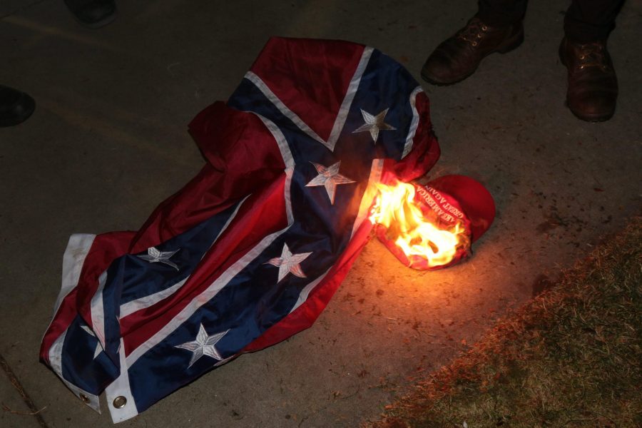 During Milo Yiannopolos visit to CU, protestors burned a confederate flag and a Make America Great Again hat. (Davis Bonner | Collegian)