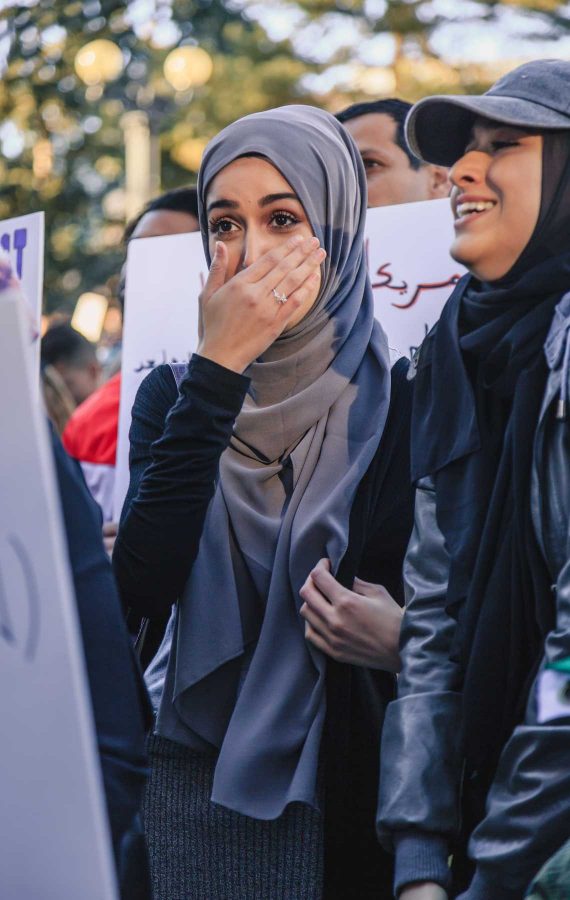 A Muslim woman is brought to tears by the large crowd showing solidarity for Muslims and immigrants despite Trump's travel ban, February 4, 2017 (Davis Bonner | Collegian)