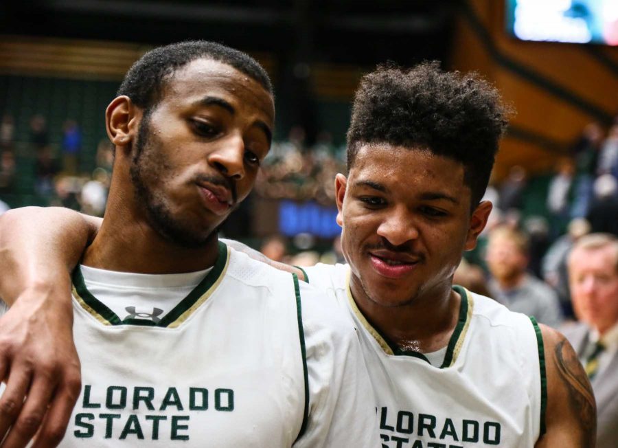 J.D. Paige and Prentiss Nixon celebrate a 69-52 win over Utah State on their way off the court. February 7, 2017 (Davis Bonner | Collegian)