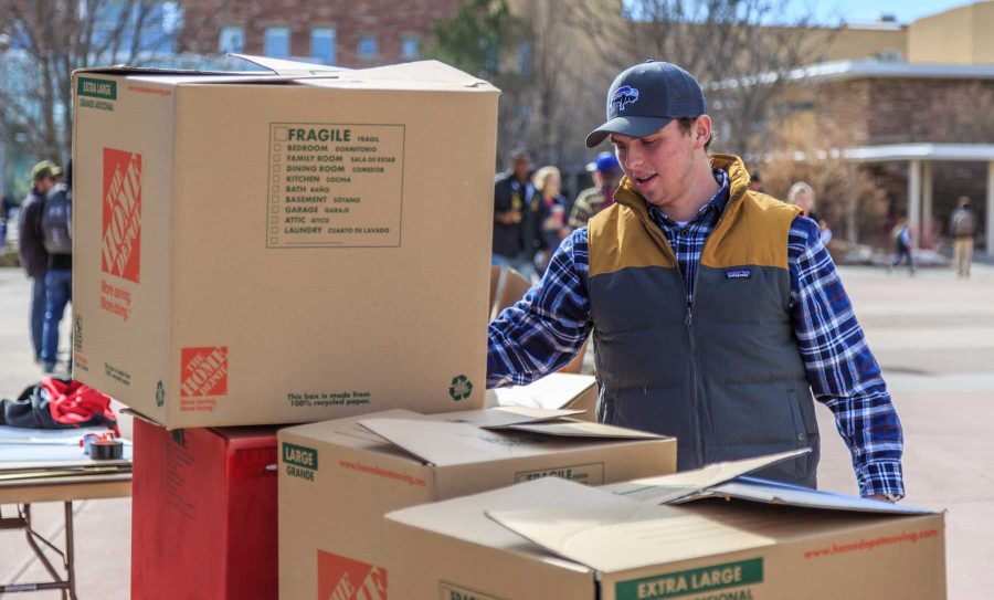 College Republicans at CSU members erect their 'Free Speech Wall' for people to write on during the "To Immigrants With Love" event on the plaza hosted by Dreamers United. February 8, 2017 (Davis Bonner | Collegian)
