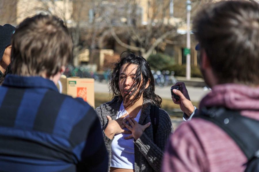 Gaby, a community organizer with Dreamers United, discusses her political views with members of College Republicans at CSU during the "To Immigrants With Love" event on the plaza. February 8, 2017 (Davis Bonner | Collegian)