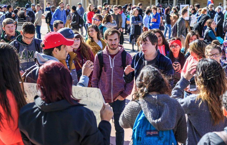 Juan Rivera and Christian Maes discuss their political views on the plaza during the "To Immigrants With Love" event hosted by Dreamers United. February 8, 2017 (Davis Bonner | Collegian)