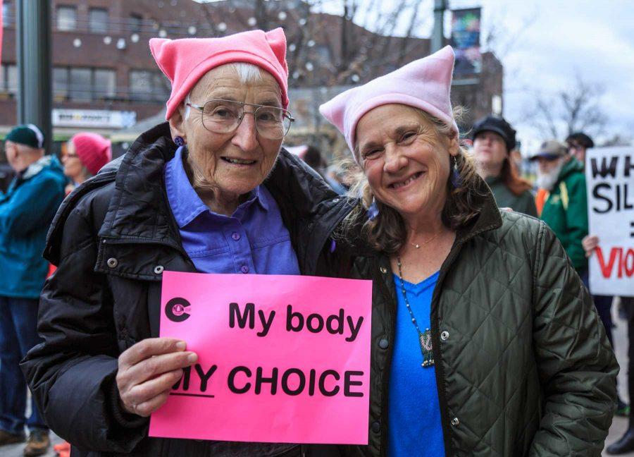 Renate Justin (right) stands with roughly 1,200 others showing solidarity with Planned Parenthood in Old Town Square. This event was organized by FoCo Local Girl Gang (Davis Bonner | Collegian)
