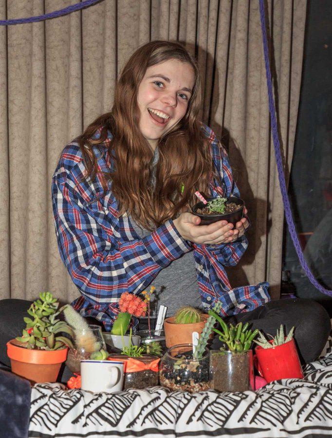 Kate Border, a freshman art major with a concentration in painting sits with her 29 succulents, a collection she grew from just a handful at the beginning of the semester. Kate is also a member of the horticulture club, one of the sources of her large plant collection (Davis Bonner | Collegian)