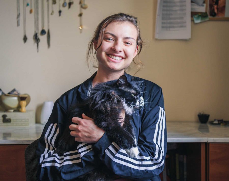 Zoe Austermann, a chemical and biological engineering major, lives with her emotional support cat Nora. Zoe is the fourth floor RA in the engineering dorms and their favorite activities include cuddling and midnight snacks (Davis Bonner | Collegian)