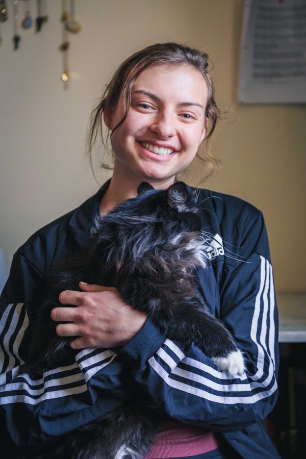 Zoe Austermann, a chemical and biological engineering major, lives with her emotional support cat Nora. Zoe is the fourth floor RA in the engineering dorms and their favorite activities include cuddling and midnight snacks (Davis Bonner | Collegian)