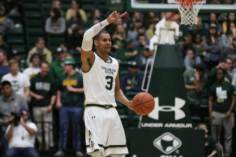Senior Gian Clavell calls out a play while bring the ball down the court against Utah State on February 7, 2016. The Rams defeated the Aggies by a score of 69-52. (Elliott Jerge | Collegian)