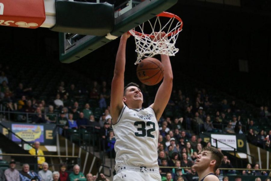Freshman Nico Carvacho slams one through the hoop during the second half of against against Utah State. The Rams came out on top by the score of 69-52. (Elliott Jerge | Collegian)