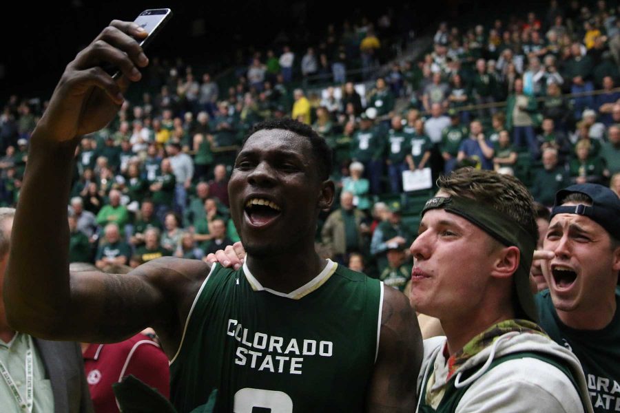 CSU Senior Emmanuel Omogbo takes a snapchat video with students after the Mens Basketball Team defeated the Wyoming Cowboys in the Second Border Wars Game on February 28. The Rams won 78-76. (Elliott Jerge | Collegian)