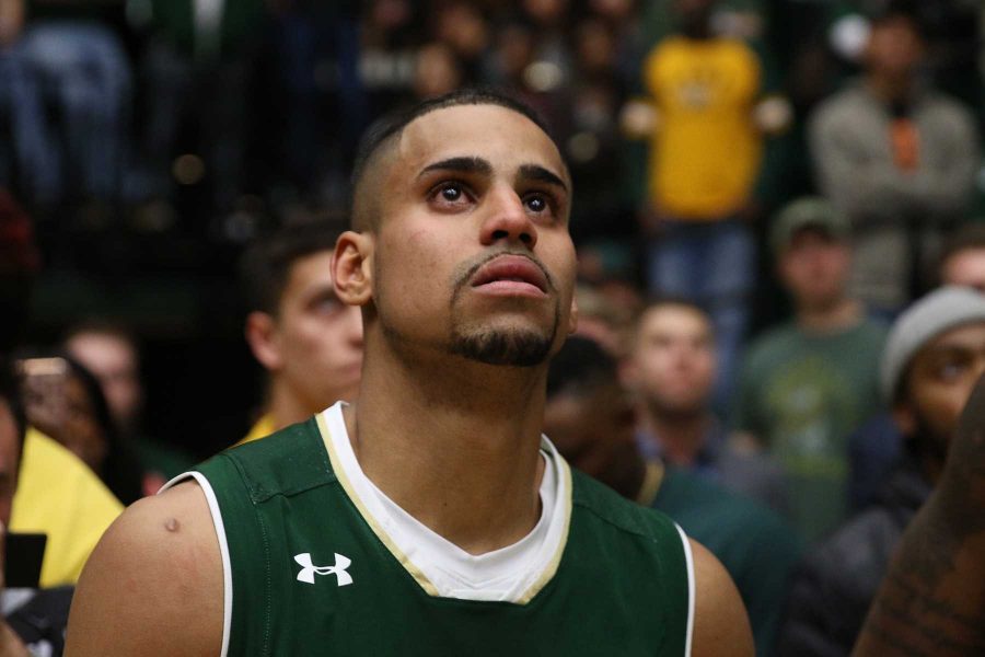 CSU Senior Gian Clavell stands and watches his video on the jumbotron before being honored at Senior Night on February 28. (Elliott Jerge | Collegian)