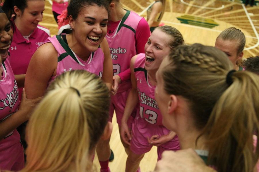 The CSU Woman's Volleyball Team celebrates a huge win over The University of New Mexico on February 22. The Rams over came the Lobos by the score of 58-55. (Elliott Jerge | Collegian)