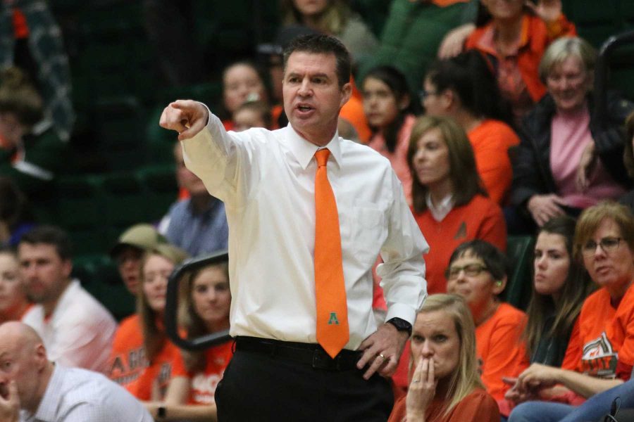 CSU women's basketball head coach Ryun Williams calls out a play to his team during the first quarter of action against the Wyoming Cowgirls. (Elliott Jerge | Collegian)