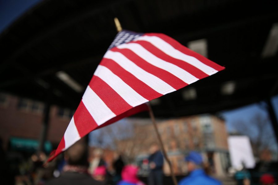 An American flag is seen pictured during a rally against Senator Cory Gardner on Sunday afternoon in Old Town. (Forrest Czarnecki | Collegian)