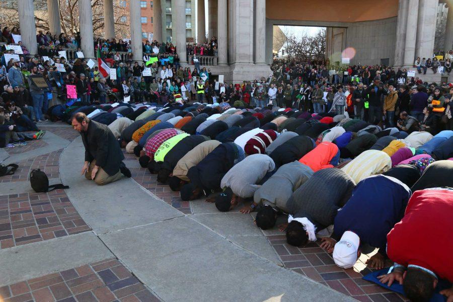The Muslims in attendence of Denvers Muslim and immigrant solidarity event take a moment for their afternoon prayer before the speakers resumed (Davis Bonner | Collegian)