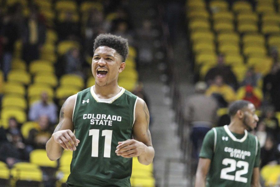 Prentiss Nixon (11) celebrates after a dagger made three point shot with 30 seconds left and four made free throws to ice the game against rival Wyoming 78-73. (Javon Harris | Collegian)