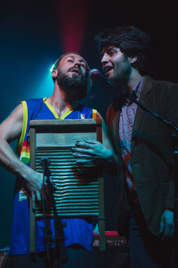 Ben Malament on washboard is joined by Lorenzo Loera on vocals during their performance in the Aggie Theater Wednesday night (Davis Bonner | Collegian)