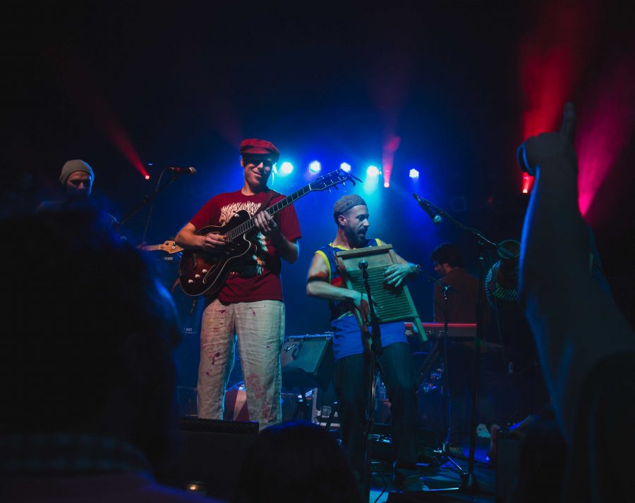 Lead vocalist Lech Wierzynski and washboard player Ben Malament from the California Honeydrops jam out Wednesday night in the Aggie Theater (Davis Bonner | Collegian)
