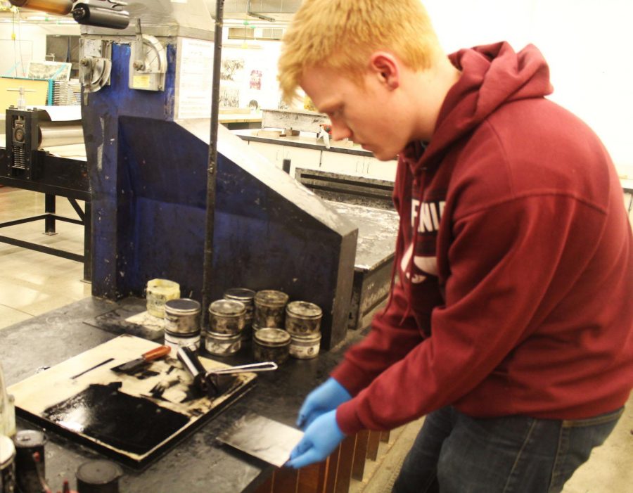 Ethan Worker Sophomore Art Major working on an an Itaglio print for his Printmaking Studio class.