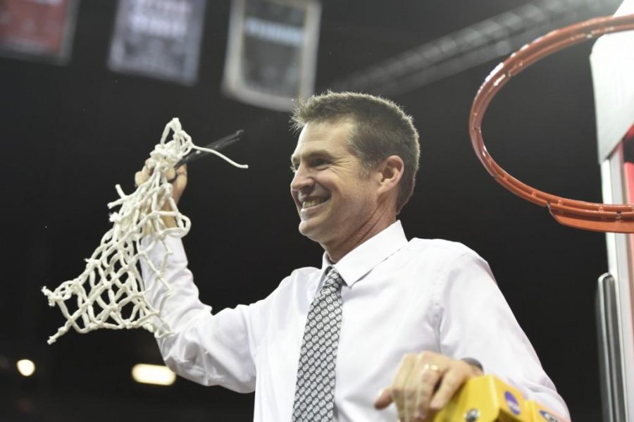 CSU head coach Ryun Williams cuts down the net during the 2016 Mountain West Conference Women's Basketball Championship (Photo by Steve Nowland | NCAA Photos)
