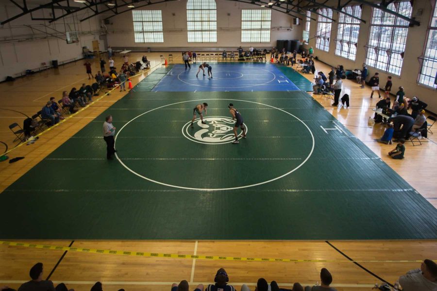 Wrestlers prepare for a match during a tournament at CSU on Feb. 25, 2017. (Abbie Parr | Collegian)