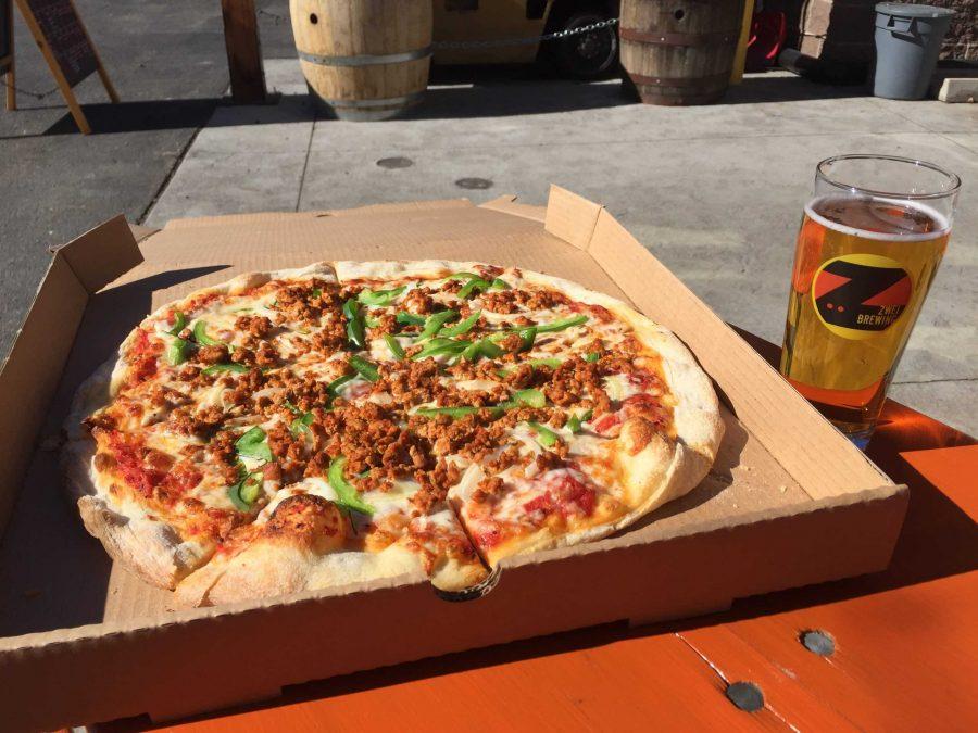 The food trucks pizza pairs nicely with a locally brewed rye lager from Zwei. Photo credit: Max Sundberg