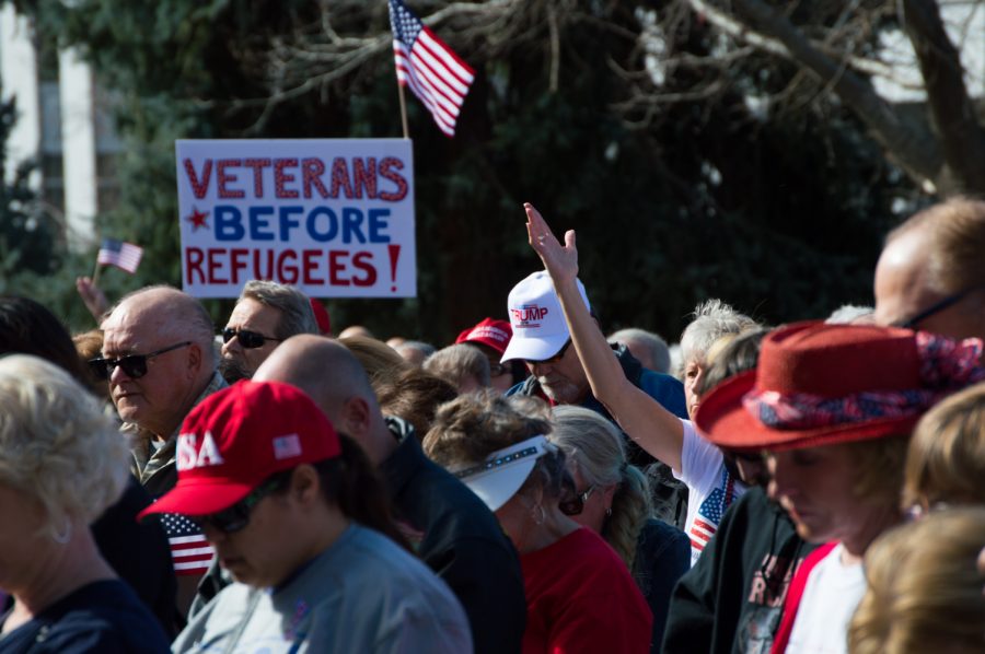Signs displayed Trump Supporters' views of the refugee debate. Photo by Kaitlyn Ancell | Collegian