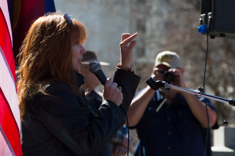 Elisabeth Wolff speaks at the March 4 Trump Rally in Denver on Saturday and tells the ANTIFA protestors to "listen just a little." Photo by Kaitlyn Ancell | Collegian