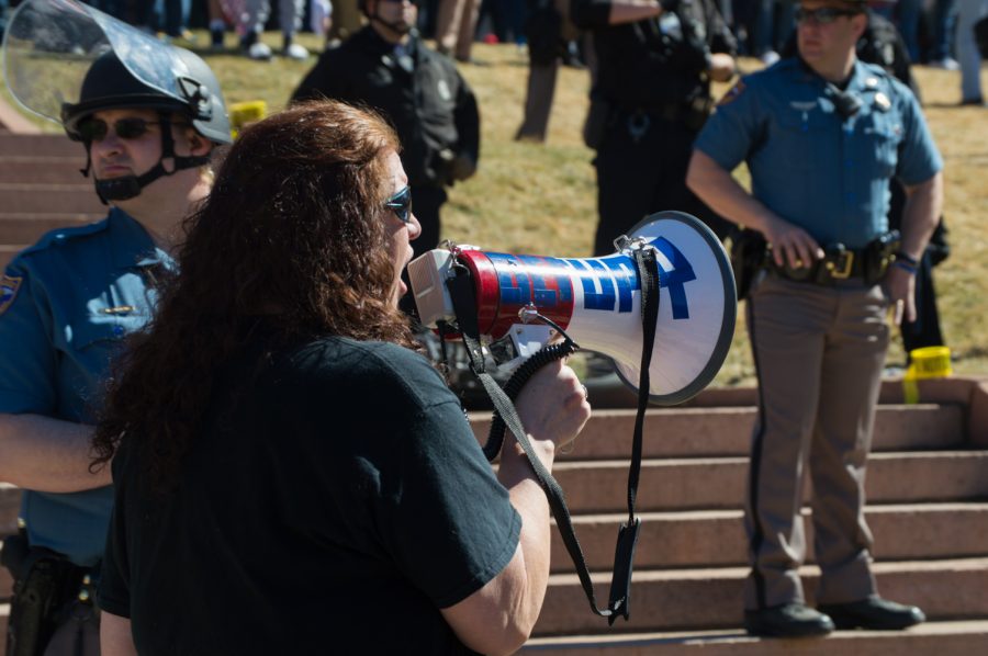 Caryn Sodaro leads the ANTIFA protest in chants and proacotive language at the March 4 Trump rally in Denver on Saturday.  Photo by Kaitlyn Ancell | Collegian