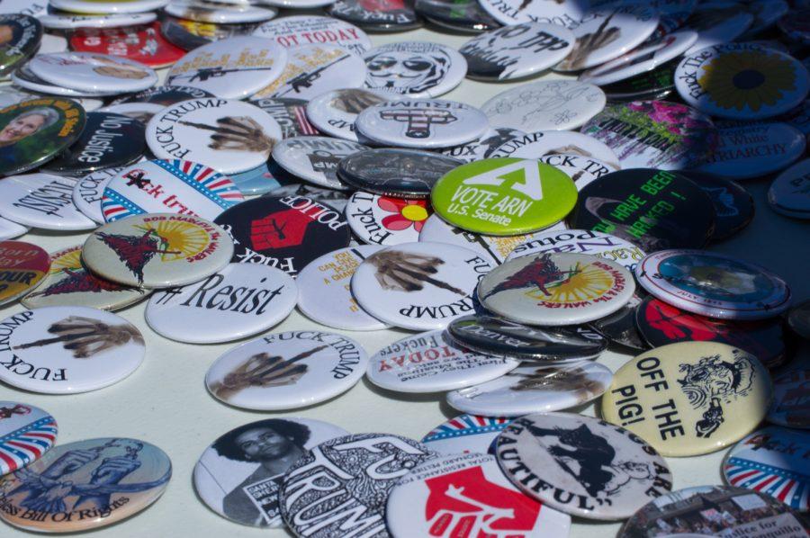 Anti-Trump buttons were being given out for donations at the March 4 Trump rally in Denver Saturday. All contributions were said to go towards feeding the homeless of Denver. Photo by Kaitlyn Ancell | Collegian
