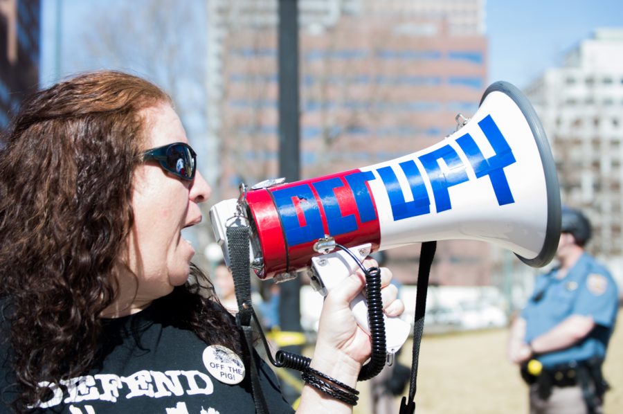 Caryn Sodaro yells at police officers while protesting at the March 4 Trump rally in Denver on Saturday. Photo by Kaitlyn Ancell | Collegian