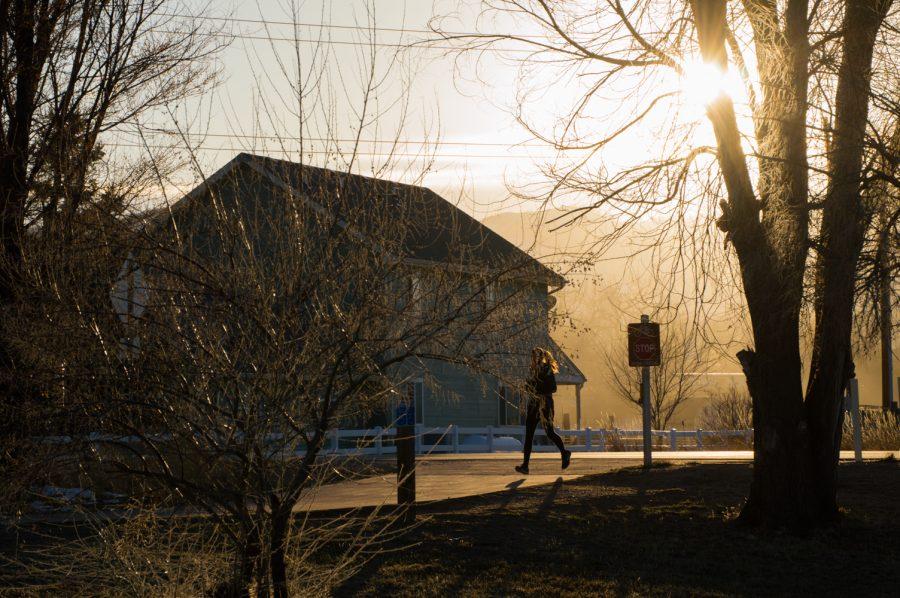 Audrey Ancell takes a run on the Poudre Trail off of Traft Hill during a warm, March sunset. Photo by Kaitlyn Ancell | Collegian