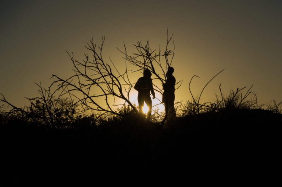 Thom Grippa and Audrey Ancell enjoy a sunset veiw on a Fort Collins hike. Photo by Kaitlyn Ancell | Collegian